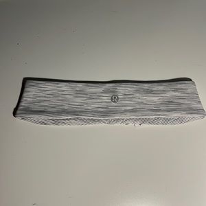 This is a gray and white faded striped Lululemon headband that is brand new!
